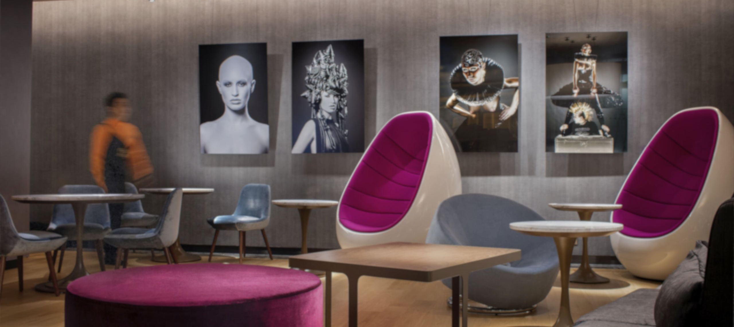 Paintings and artsy furniture in Ebb & Flow Lobby Lounge at the Park Lane Hong Kong, a Pullman Hotel